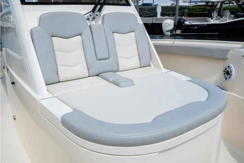 Slide: The Image of 2023 Scout 330 LXF boat with comfortable seating and modern design. - 39