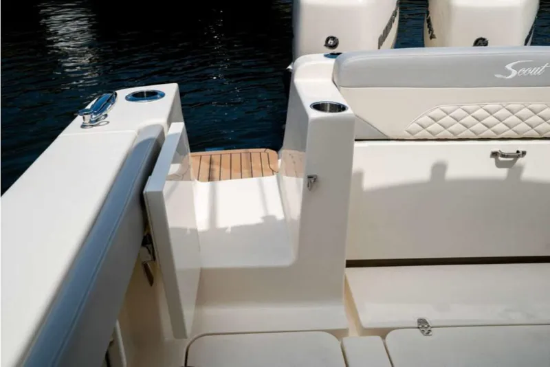 Slide: The Image of 2023 Scout 330 LXF boat interior with seating and access door. - 43