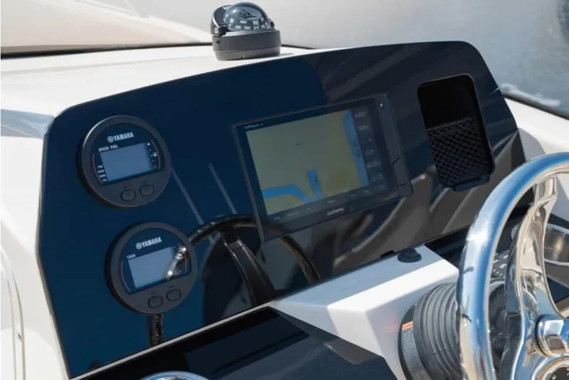 Slide: The Image of 2023 Scout 215 Dorado boat dashboard with Yamaha gauges and Garmin navigation system. - 22