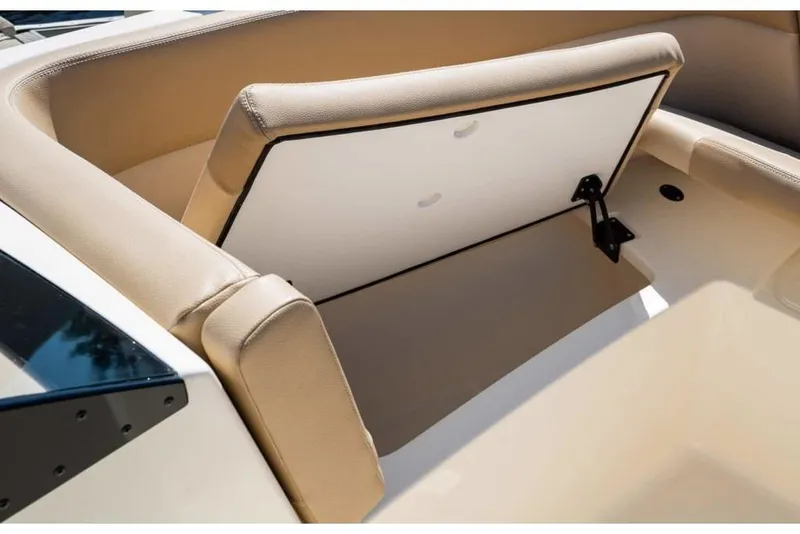 Slide: The Image of 2023 Scout 215 Dorado boat with open storage compartment. - 26