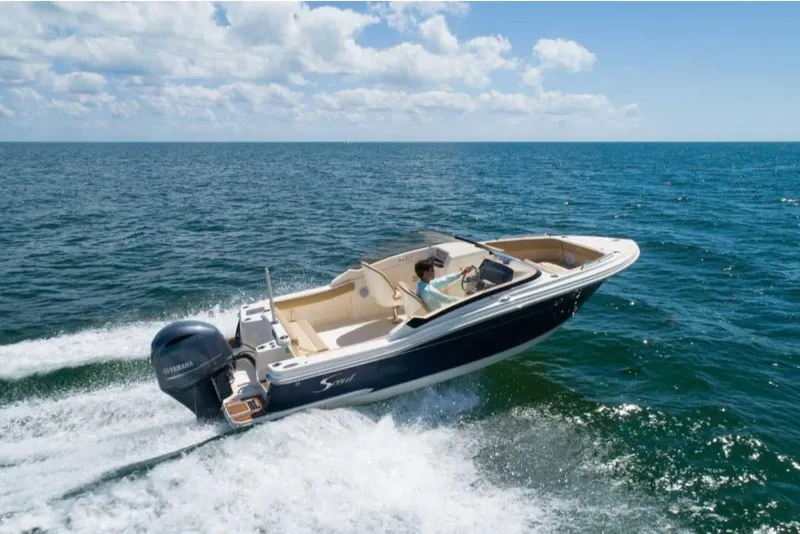 Slide: The Image of 2023 Scout 215 Dorado boat cruising on open water. - 3
