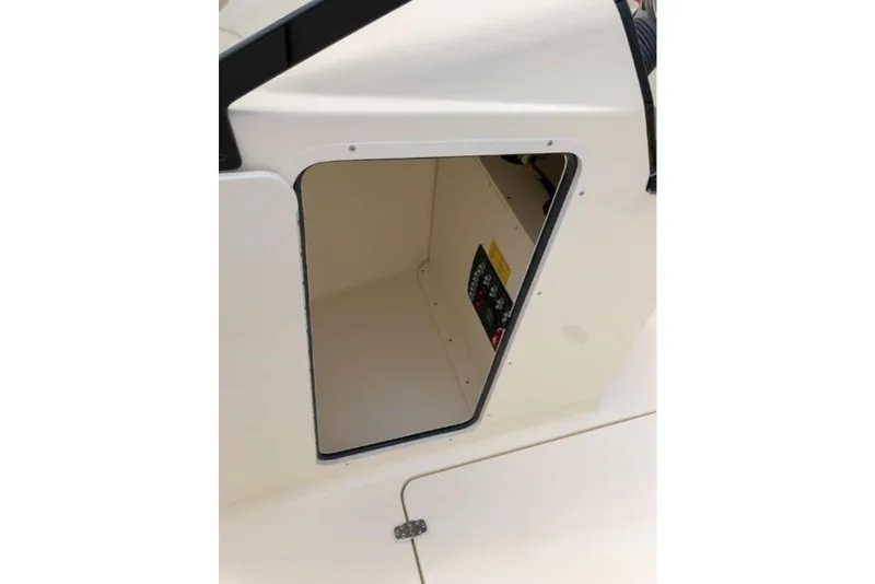 Slide: The Image of 2023 Scout 215 Dorado storage compartment with open hatch. - 38