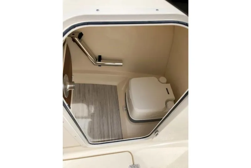 Slide: The Image of 2023 Scout 215 Dorado boat interior with compact marine toilet. - 39