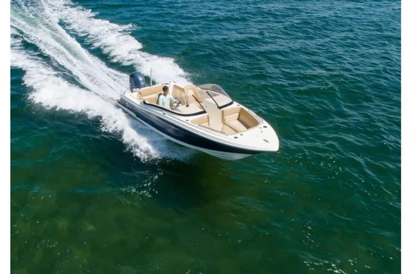 Slide: The Image of 2023 Scout 215 Dorado boat cruising on open water. - 5