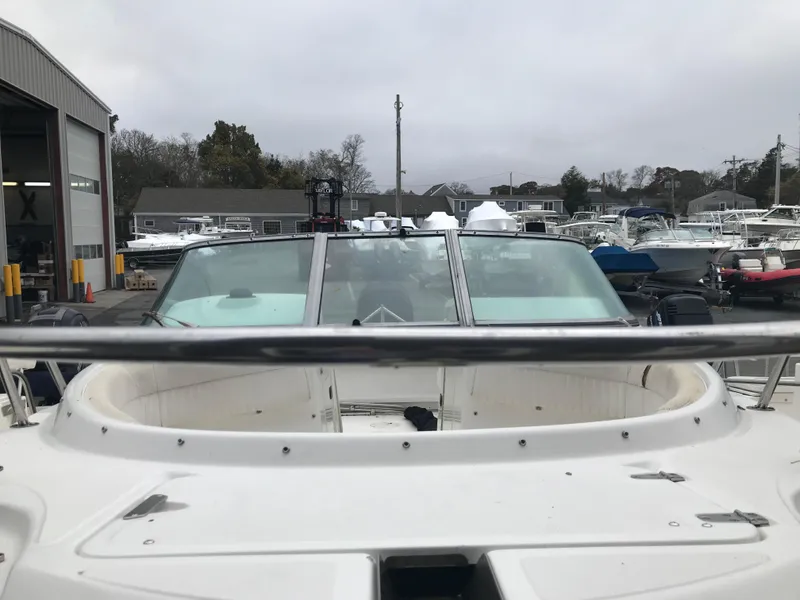 Slide: The Image of 2005 Boston Whaler VENTURA 210 boat docked at marina. - 4