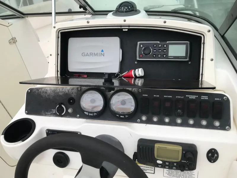 Slide: The Image of Dashboard of a 2005 Boston Whaler VENTURA 210 with Garmin device. - 8