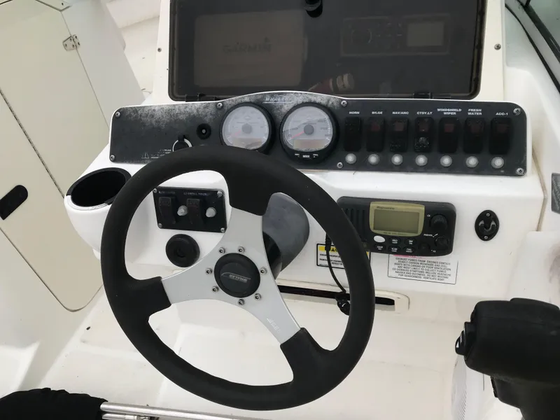 Slide: The Image of Steering console of a 2005 Boston Whaler VENTURA 210 boat. - 9