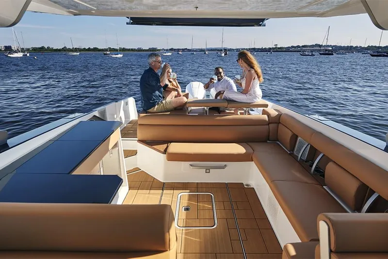 Slide: The Image of 2023 Aviara AV36 boat with people enjoying the spacious deck on the water. - 12