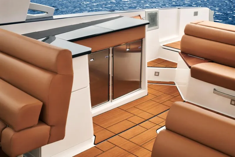 Slide: The Image of 2023 Aviara AV36 boat interior with tan leather seating and wooden flooring. - 13