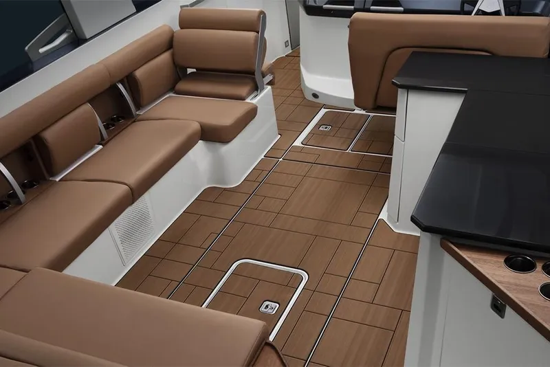 Slide: The Image of 2023 Aviara AV36 boat interior with brown leather seating and wood flooring. - 15