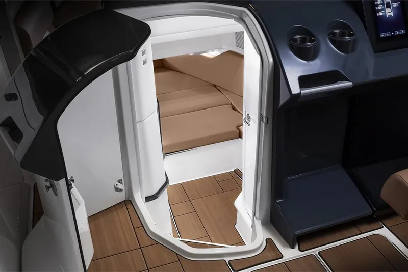 Slide: The Image of 2023 Aviara AV36 cabin interior with wood flooring and cushioned seating. - 18