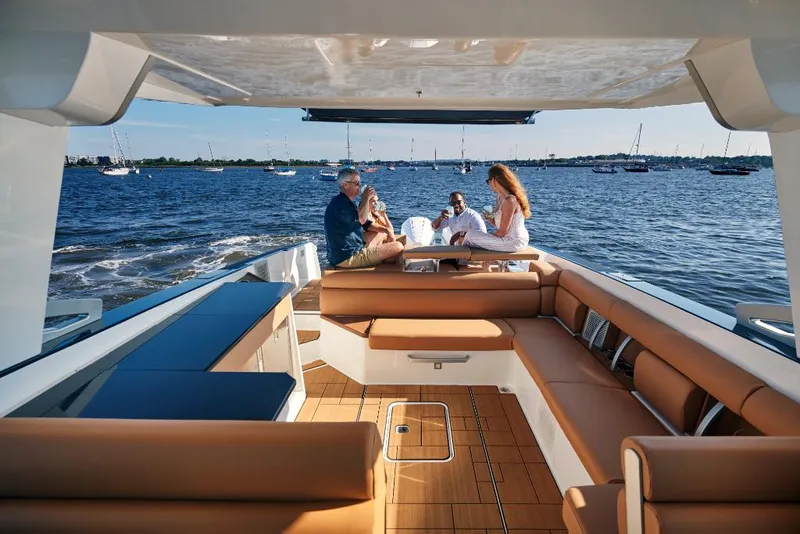 Slide: The Image of 2023 Aviara AV36 luxury boat with people enjoying the spacious deck on a sunny day. - 27