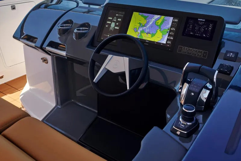 Slide: The Image of 2023 Aviara AV36 boat helm with navigation screens and controls. - 7