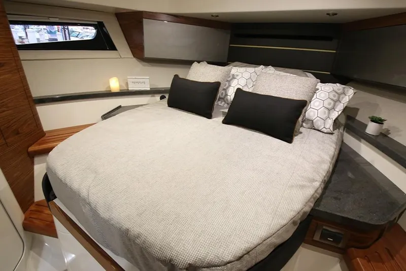 Slide: The Image of Luxurious cabin interior of 2023 Boston Whaler 405 Conquest with cozy bed and modern decor. - 15