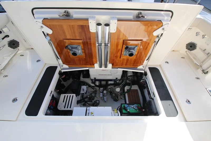 Slide: The Image of 2023 Boston Whaler 405 Conquest engine compartment with open hatch. - 29