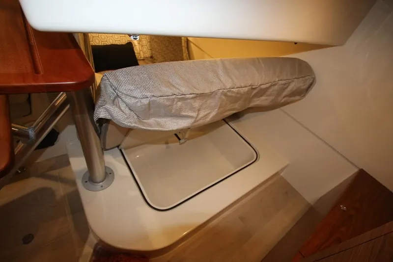 Slide: The Image of Interior of 2023 Boston Whaler 405 Conquest boat showing a storage compartment. - 32