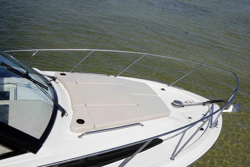 Slide: The Image of 2023 Boston Whaler 325 Conquest boat bow on calm water. - 3