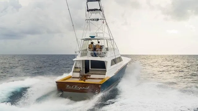 Slide: The Image of Jim Smith Custom 66 Sportfish boat cruising on open sea, 1999 model. - 2