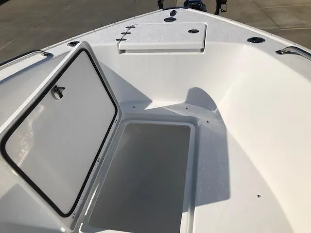 Slide: The Image of 2024 Cape Horn 22 boat with open storage compartments. - 6