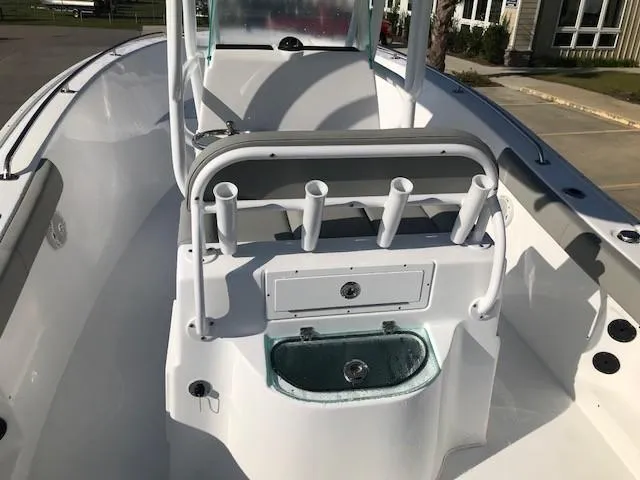 Slide: The Image of 2024 Cape Horn 22 boat interior with rod holders and storage compartments. - 9