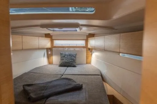 Slide: The Image of Luxurious cabin interior of 2025 X-Yachts X4.3 with modern design and cozy bedding. - 7