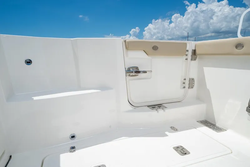 Slide: The Image of 2025 Pursuit DC 326 boat deck with open door and blue sky. - 24