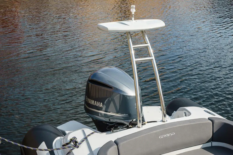 Slide: The Image of 2024 Grand Inflatables G850 boat with Yamaha outboard motor on water. - 9