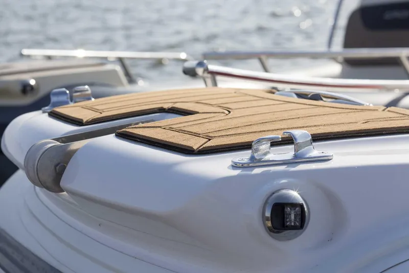 Slide: The Image of 2024 Grand Inflatables G650 boat deck with teak flooring and stainless steel fittings. - 29