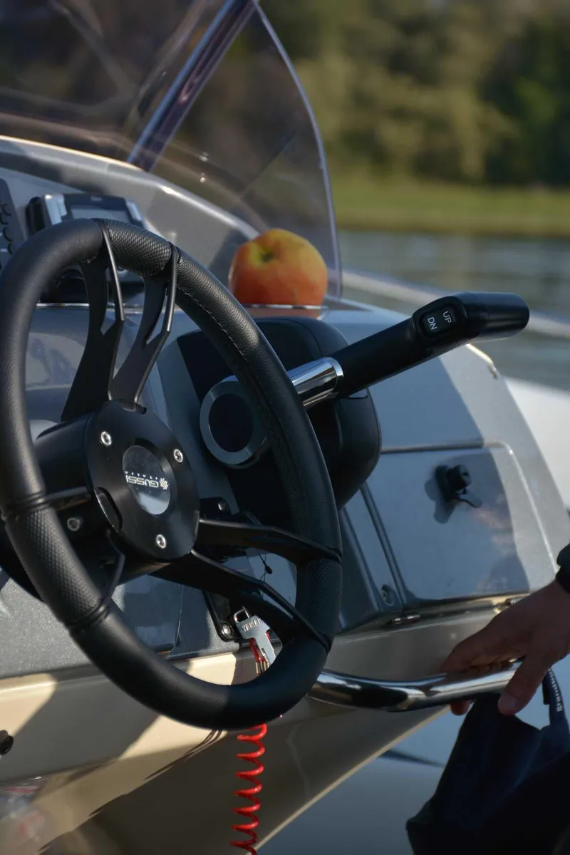 Slide: The Image of Steering wheel of 2024 Grand Inflatables G650 boat with control panel. - 6
