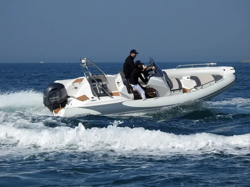 Slide: The Image of 2024 Grand Inflatables G580 boat cruising on the ocean. - 26