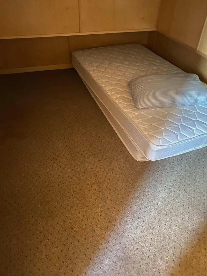 Slide: The Image of Single mattress in a 2003 Stardust Cruisers Red Rock Retreat Week 26 houseboat bedroom. - 11