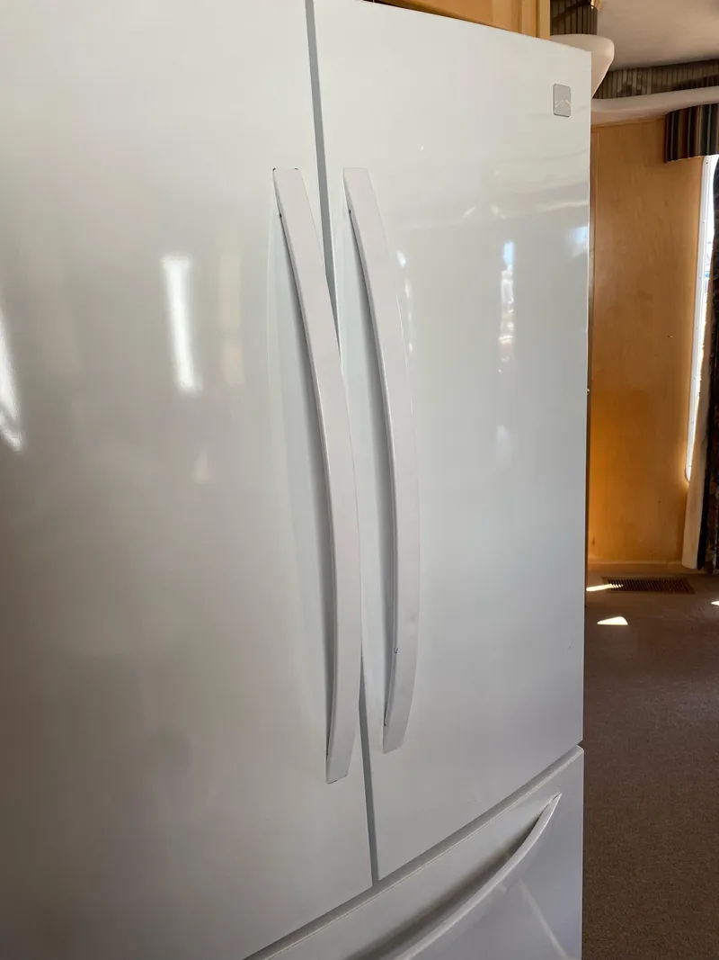 Slide: The Image of White double-door refrigerator in a 2003 Stardust Cruisers Red Rock Retreat Week 26 houseboat. - 20