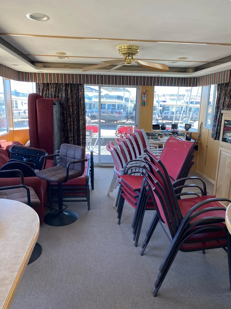 Slide: The Image of Interior of 2003 Stardust Cruisers Red Rock Retreat Week 26 houseboat with stacked chairs. - 24
