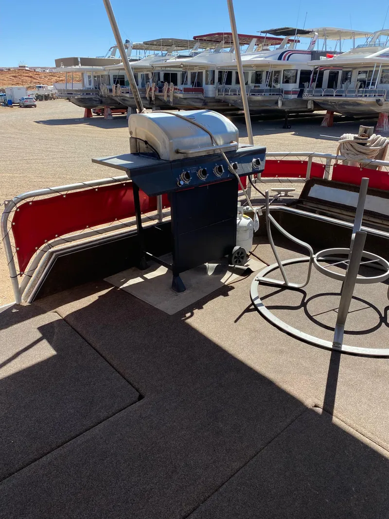 Slide: The Image of Outdoor deck with a grill on a 2003 Stardust Cruisers Red Rock Retreat Week 26 houseboat. - 27