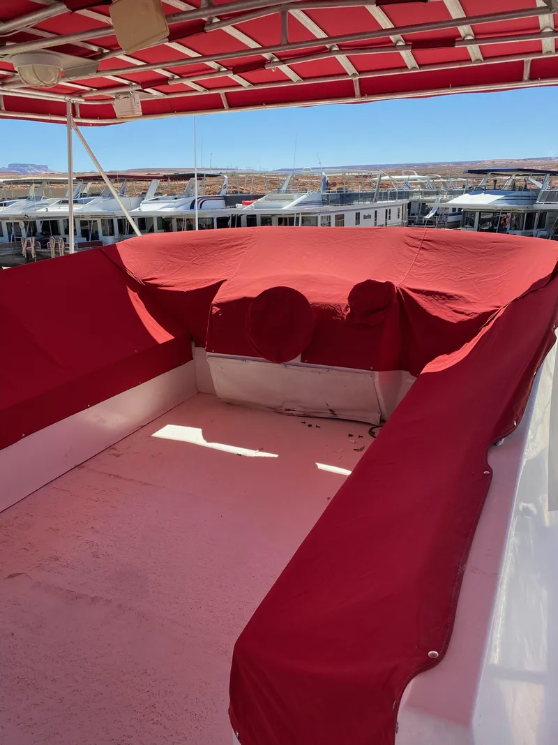 Slide: The Image of 2003 Stardust Cruisers Red Rock Retreat Week 26 houseboat with red canopy and seating. - 32
