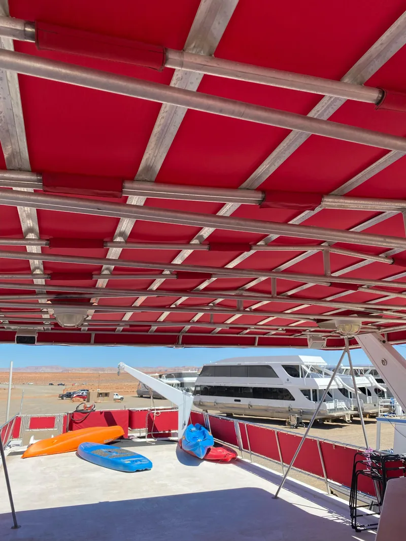 Slide: The Image of Houseboat deck with kayaks, Stardust Cruisers Red Rock Retreat Week 26, 2003 model. - 34