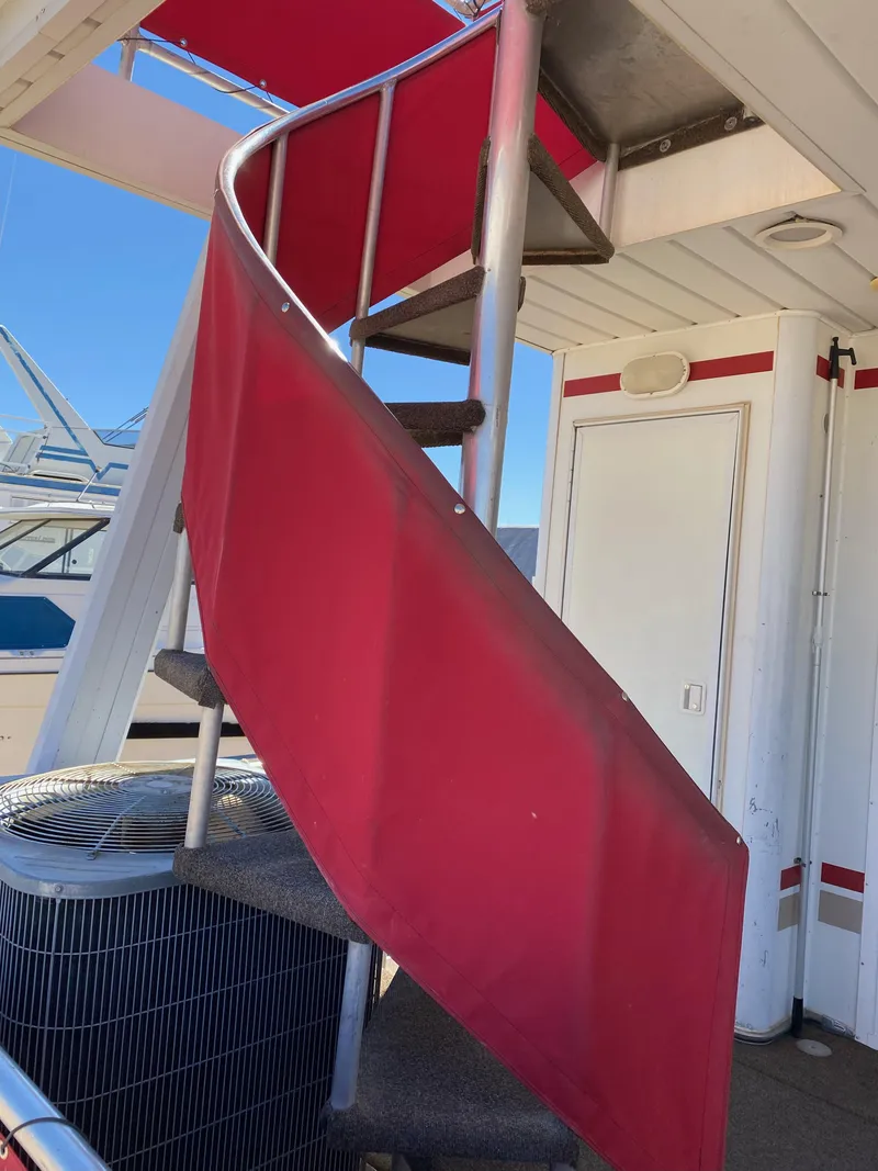 Slide: The Image of Red spiral staircase on 2003 Stardust Cruisers Red Rock Retreat Week 26 houseboat. - 4