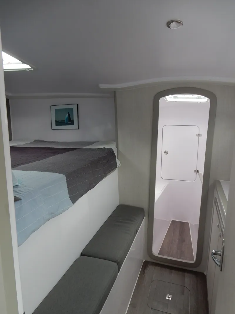 Slide: The Image of Interior of 2025 Seawind 1190 Sport catamaran, featuring cozy cabin and modern design. - 9