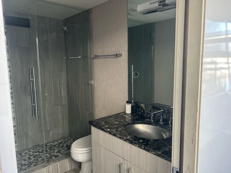 Slide: The Image of Modern bathroom with glass shower, granite countertop, and sleek fixtures in Adonia Aquarius 2016 model. - 11