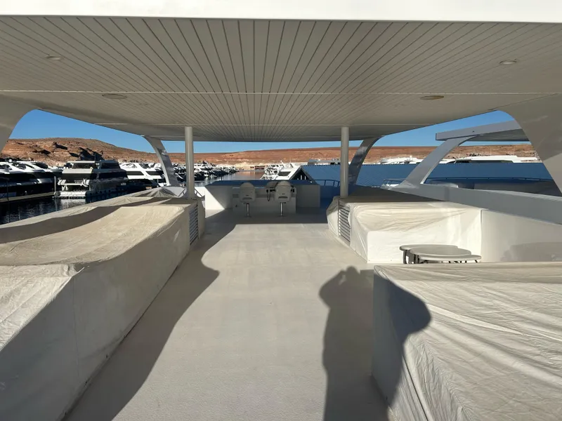 Slide: The Image of Spacious deck of 2016 Adonia Aquarius Shared Ownership yacht in marina. - 16