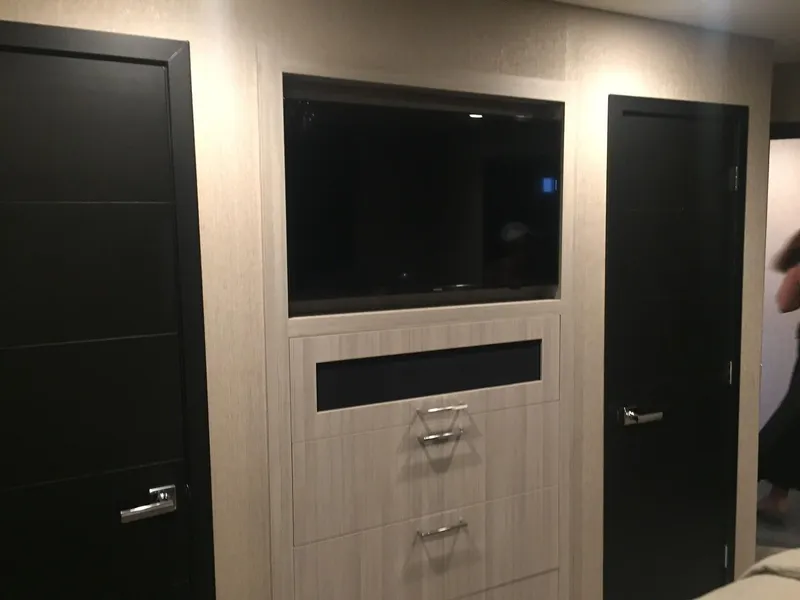 Slide: The Image of Modern interior of 2016 Adonia Aquarius, featuring sleek cabinetry and black doors. - 3