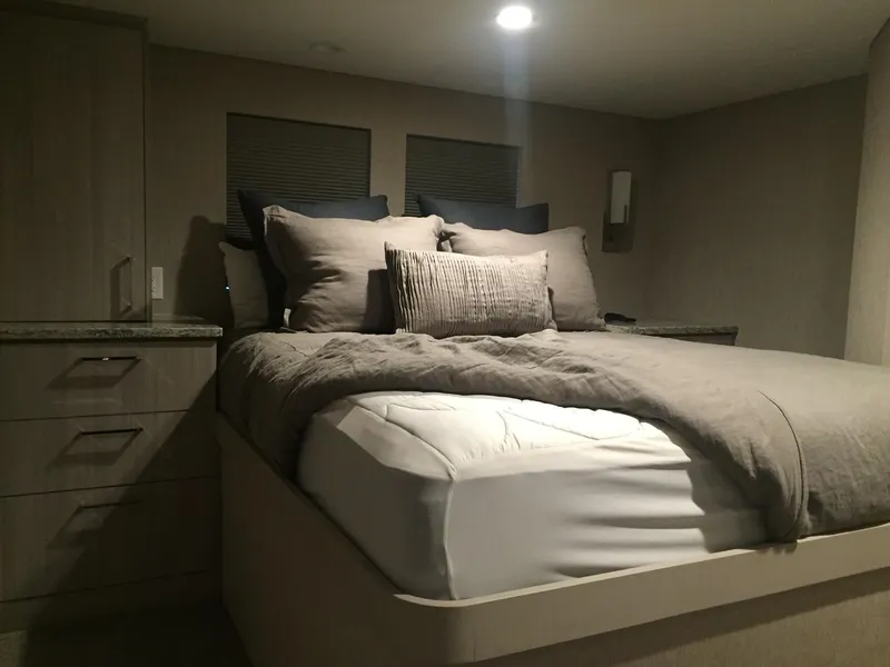 Slide: The Image of Cozy bedroom in 2016 Adonia Aquarius Shared Ownership boat, featuring a plush bed and modern decor. - 4