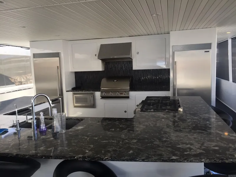 Slide: The Image of Luxurious yacht kitchen with modern appliances, marble countertops, and sleek design, Adonia Aquarius 2016. - 6