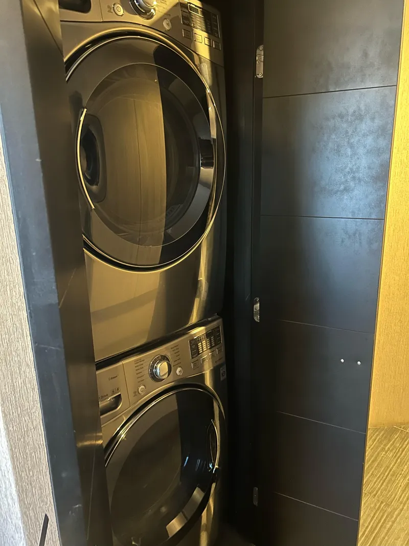 Slide: The Image of Stacked washer and dryer in compact laundry closet, Adonia Aquarius 2016 model. - 9