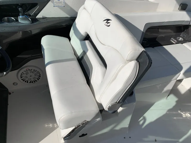 Slide: The Image of 2012 Monterey 328 Super Sport boat with white leather seating. - 16