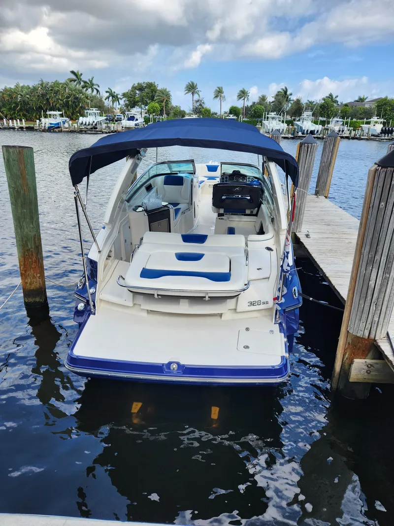 Slide: The Image of 2012 Monterey 328 Super Sport boat docked at a marina. - 26