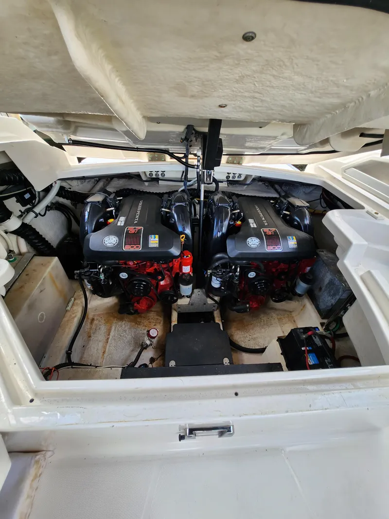 Slide: The Image of Engine compartment of a 2012 Monterey 328 Super Sport boat with twin engines. - 35