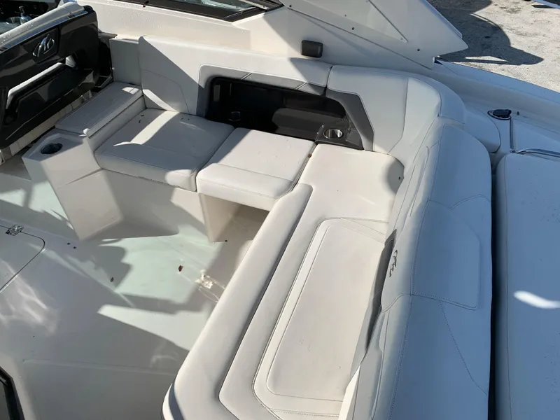 Slide: The Image of 2012 Monterey 328 Super Sport boat interior with white leather seating. - 9