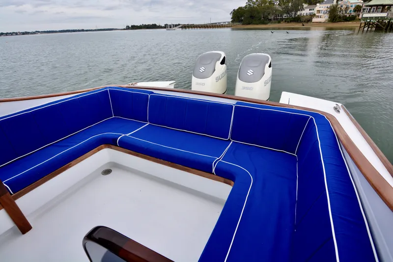 Slide: The Image of 2018 Maverick Yachts Costa Rica 32 Custom Carolina Picnic Boat with blue seating and twin outboard engines. - 5