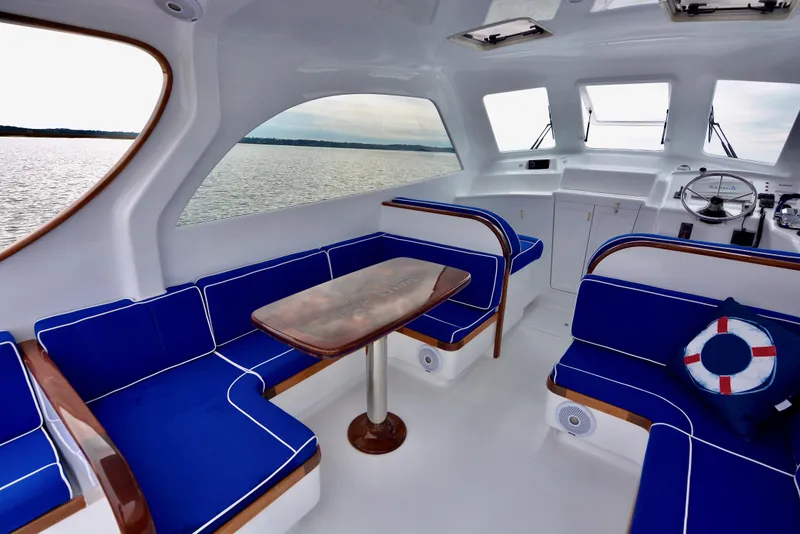 Slide: The Image of Interior of 2018 Maverick Yachts Costa Rica 32 Custom Carolina Picnic Boat with blue seating. - 7